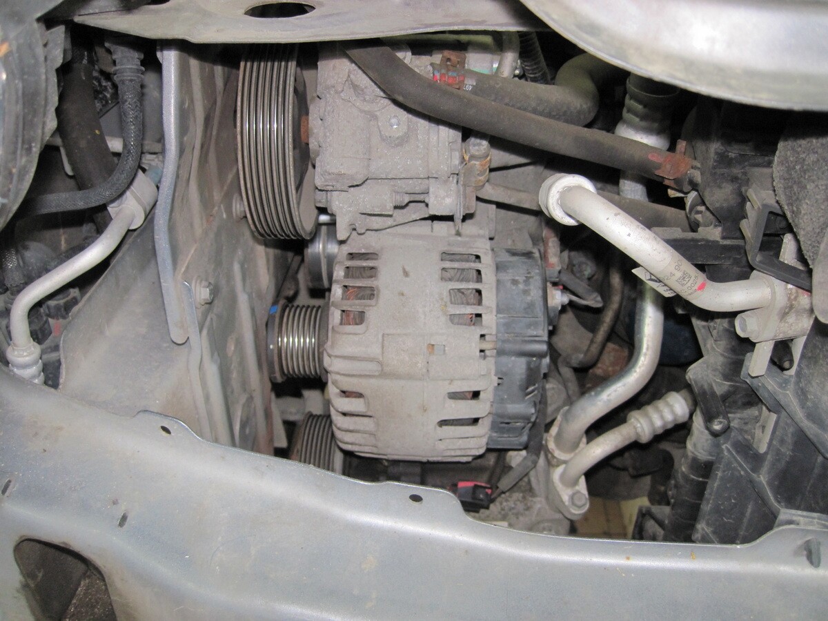 Close-up of alternator with visible copper windings